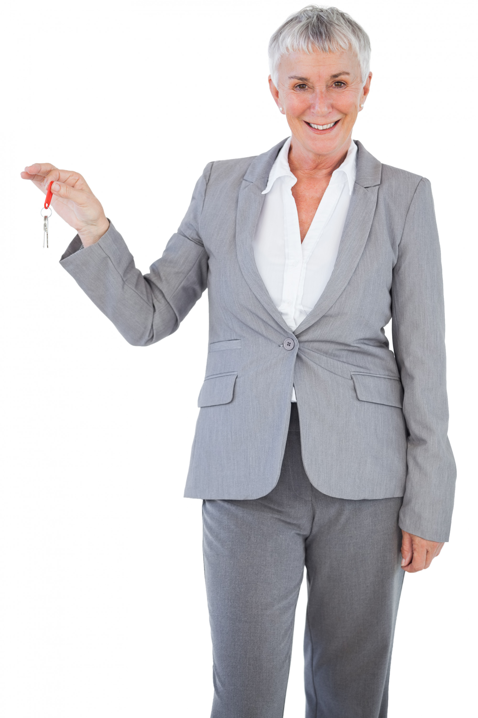 real estate agent handing keys to clients